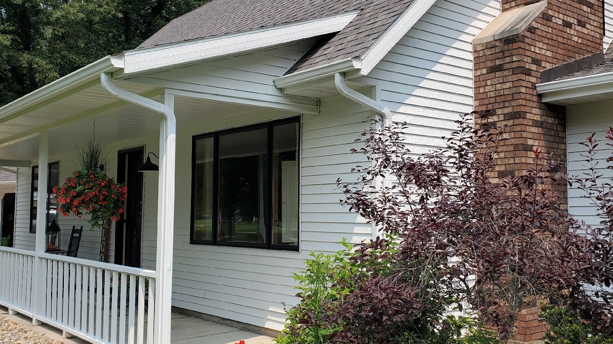 White house exterior with porch railings freshly painted